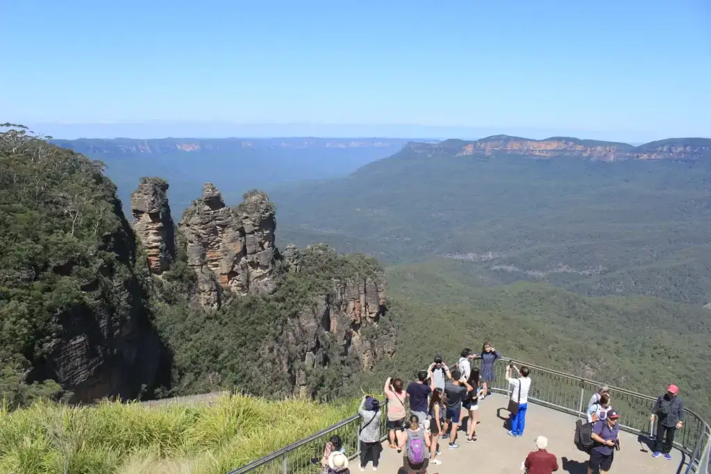 Three sisters blue mountains mass tourism Australia. Large group of tourists taking photos of the Three Sisters in the Blue mountains in Australia.