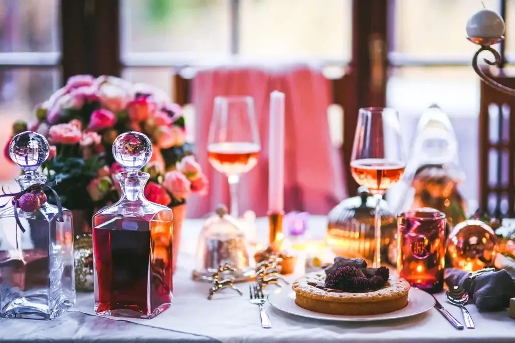 Table setting with glasses of rose wine