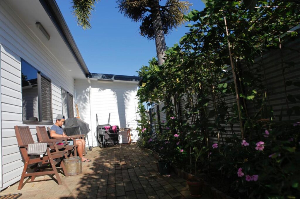 Outdoor sun terrace where guests realax and soak up some rays at - Happytourcairns Sharehouse