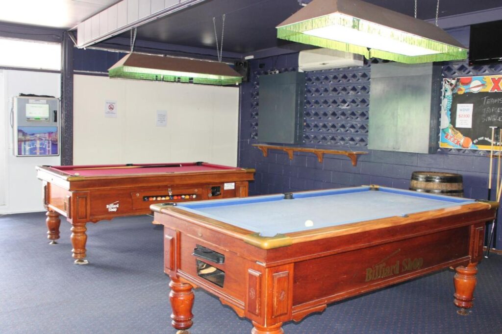 Games room for playing pool with locals or fellow travellers at Tin Can Bay Budget Accommodation