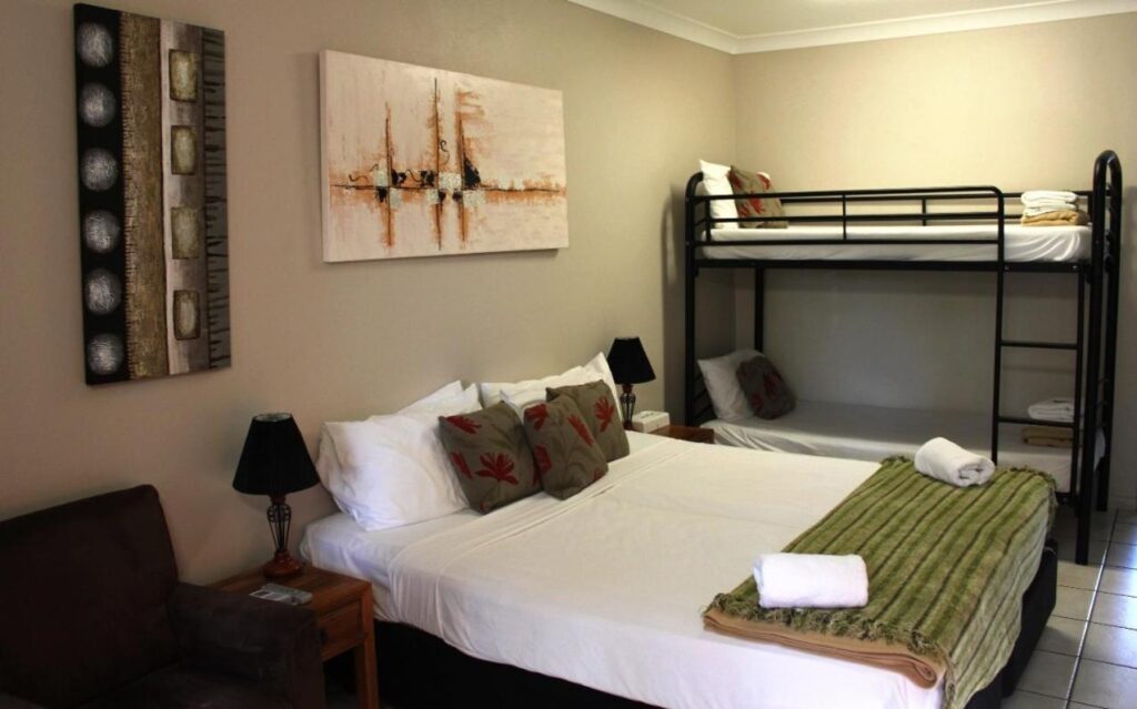 A private shared room with queen bed and a bunk bed at Bohemia Resort Cairns