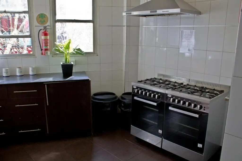 Two stoves and a bench where guests can cook breakfasts lunches or dinners at Mad Monkey Kings Cross