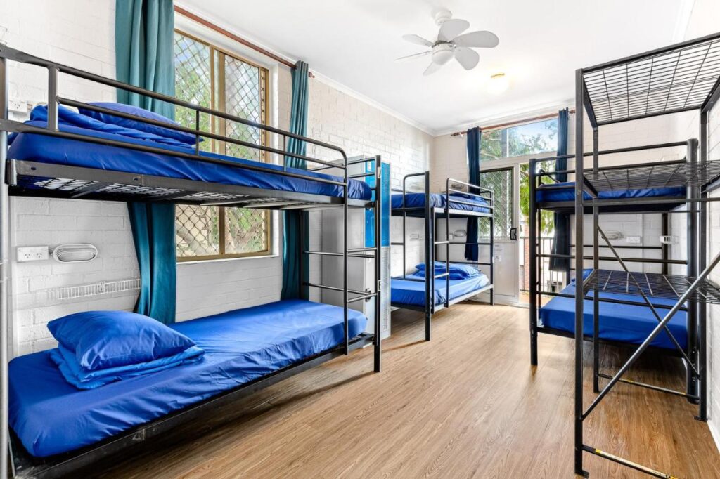 A six-bed dormitory with clean sheets airy room and lots of sunlight at Newtown Backpackers