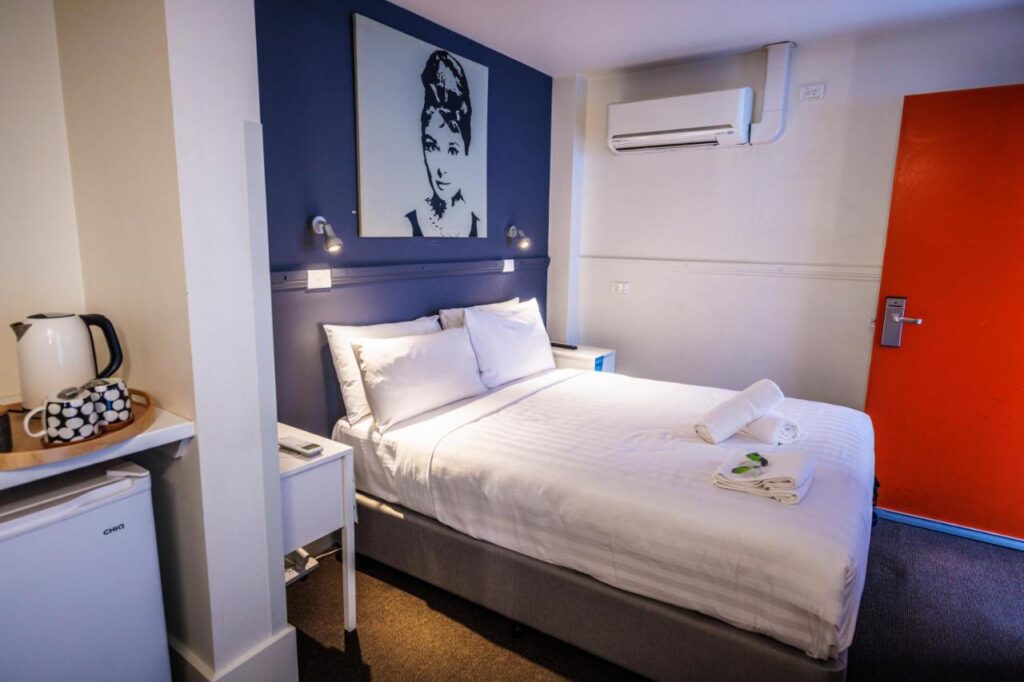 A private room with fresh clean sheets and air conditioning at YHA Melbourne Central